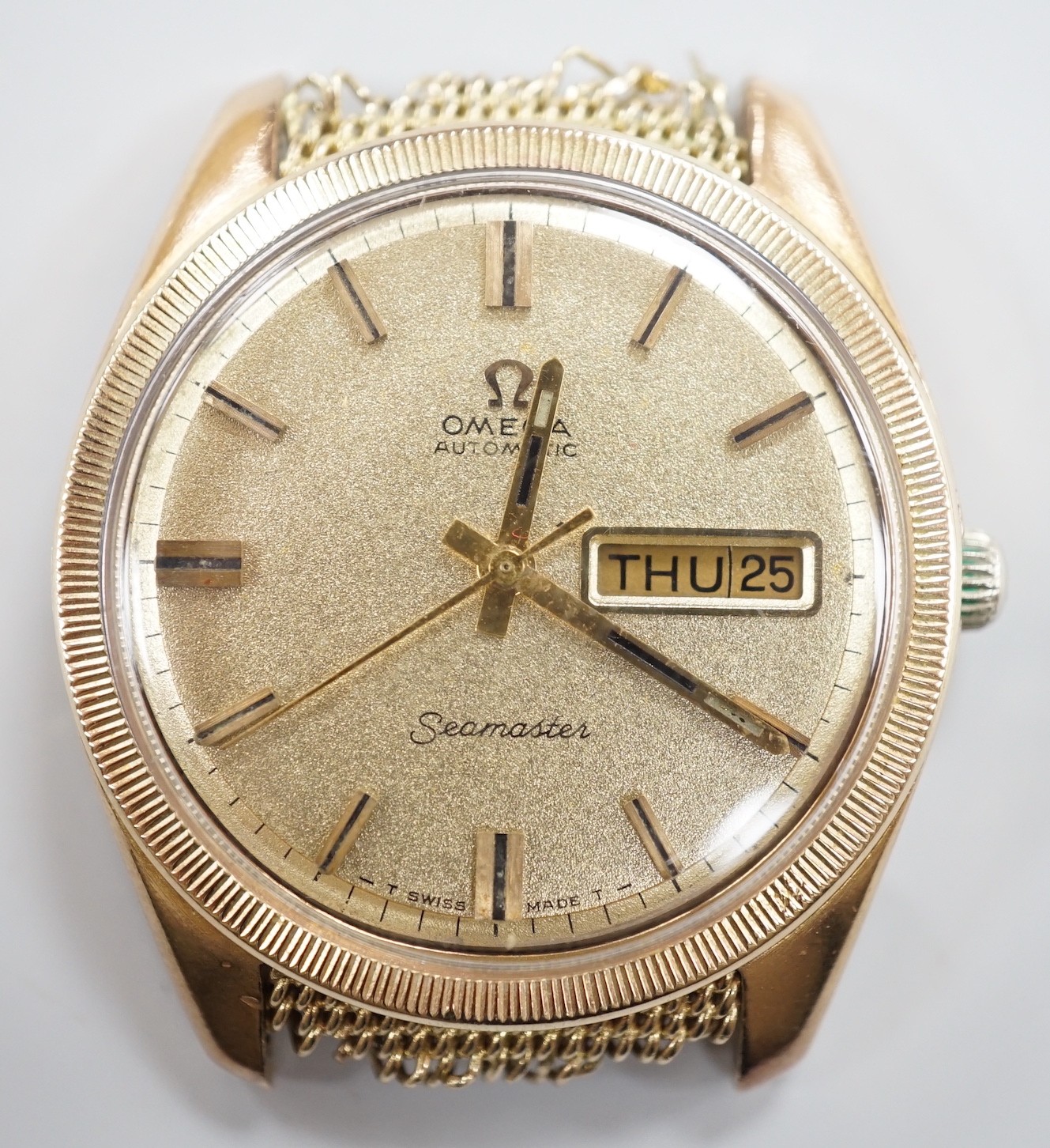 A gentleman's late 1960's 9ct gold Omega Seamaster Automatic day/date wrist watch, (lacking bracelet but remnants still visible), case diameter 36mm, movement c.752, with part paperwork, no box.